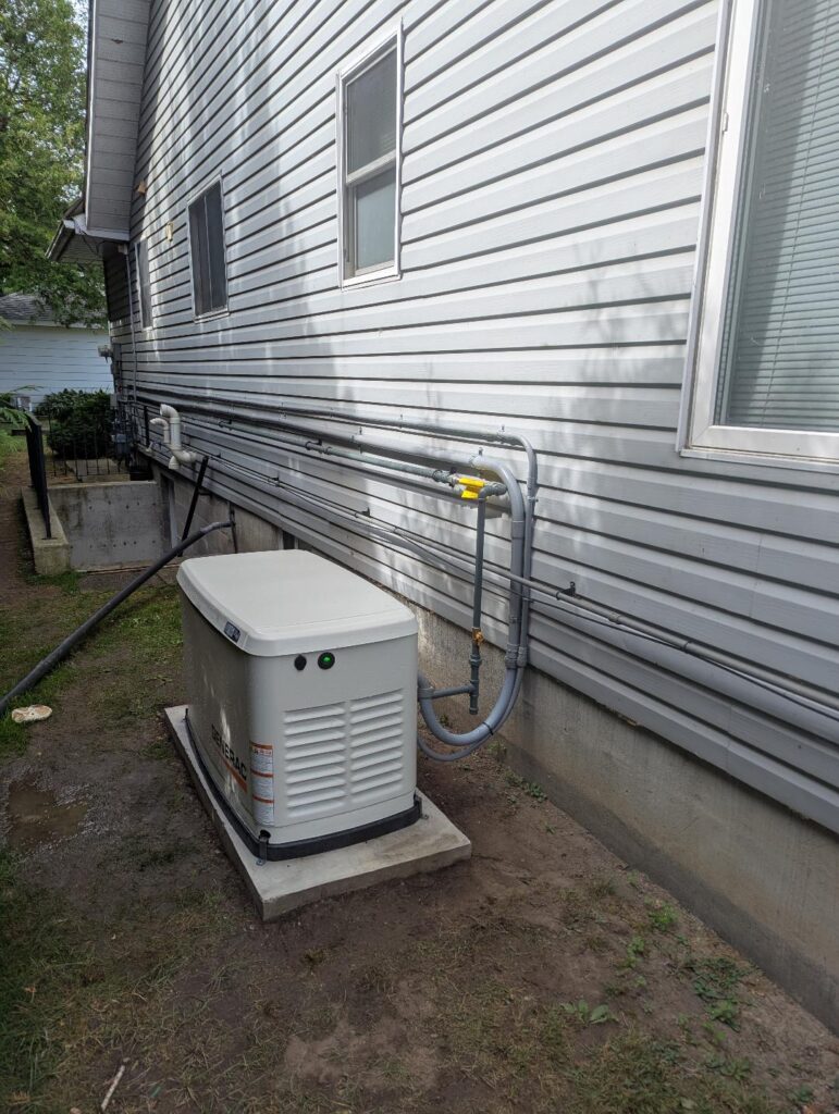 Standby generator installed beside a home
